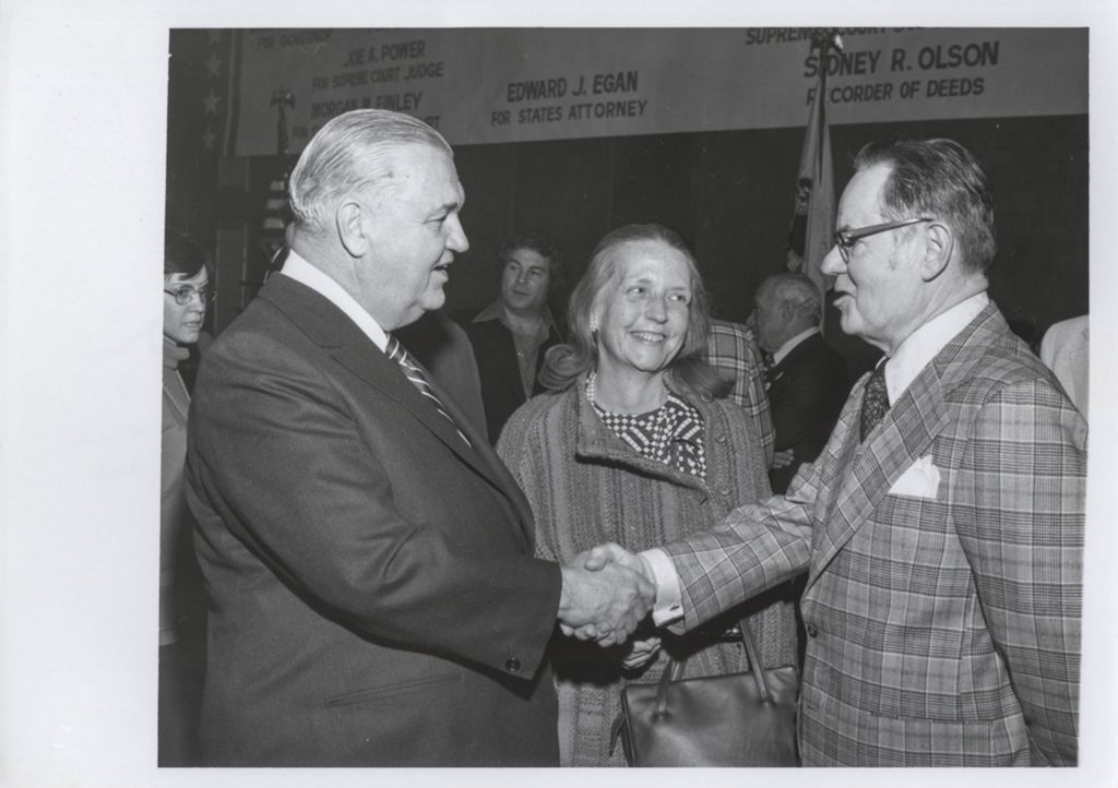 Michael J. Howlett shaking hands at Democratic Club of Winnetka event