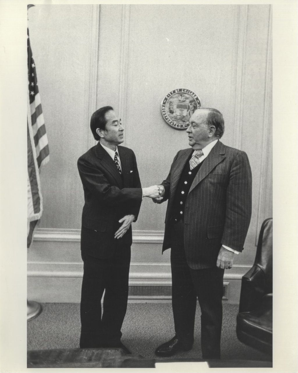 Ambassador Takeshi Yasukawa shaking hands with Richard J. Daley