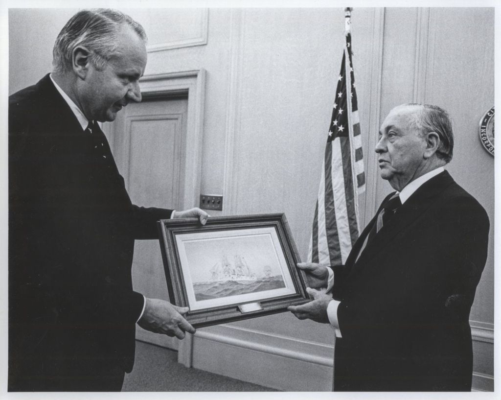 Miniature of Richard J. Daley and a man holding a painting of a ship