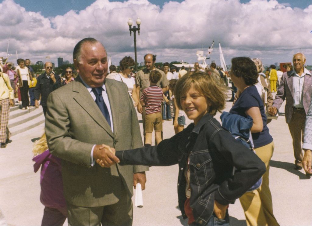 Richard J. Daley shaking hands with a boy at Navy Pier