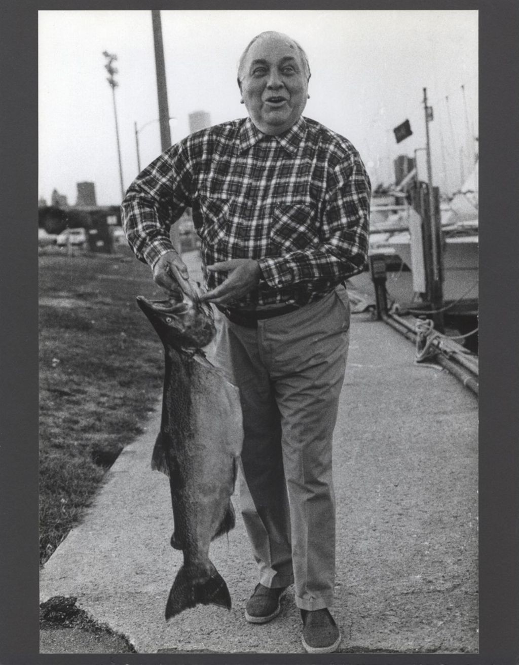 Richard J. Daley with a coho salmon