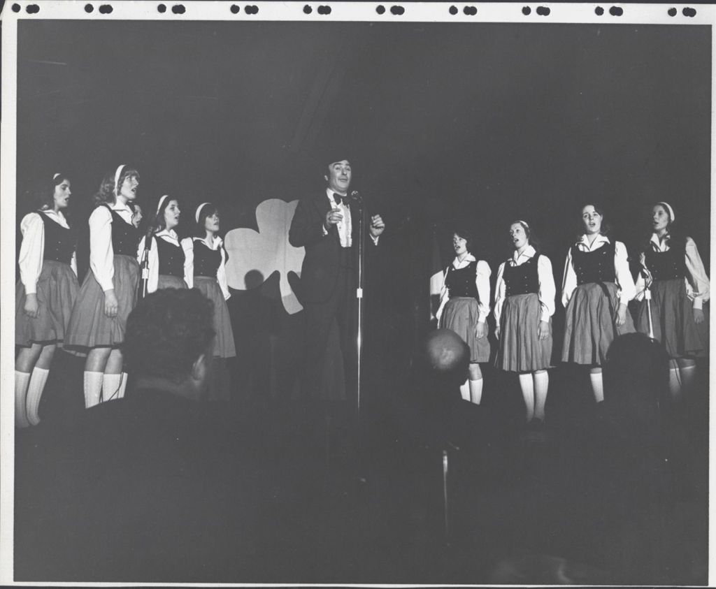 Singing group performing onstage