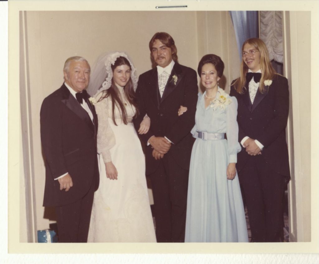 Mr. and Mrs. Fahey Flynn and family at a wedding