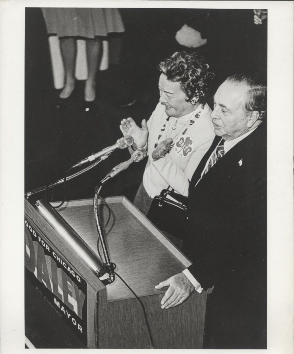 Eleanor and Richard J. Daley at a podium on election night