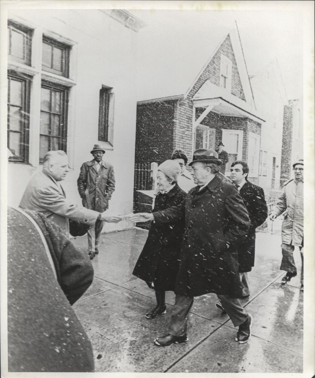 Richard J. Daley, Eleanor Daley and John Daley walking to polling place