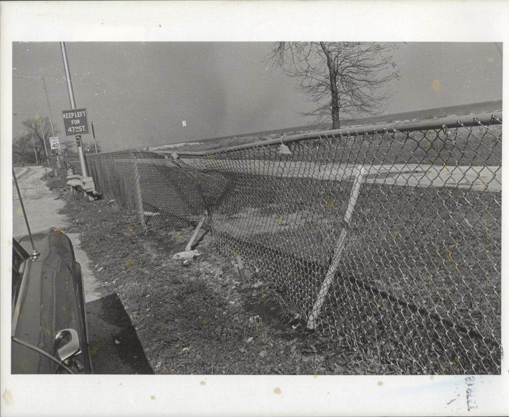 Miniature of Highway view with damaged chain-link fence