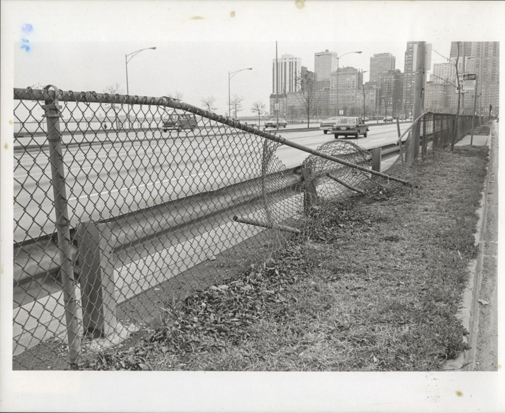 Miniature of Highway view with damaged chain-link fence