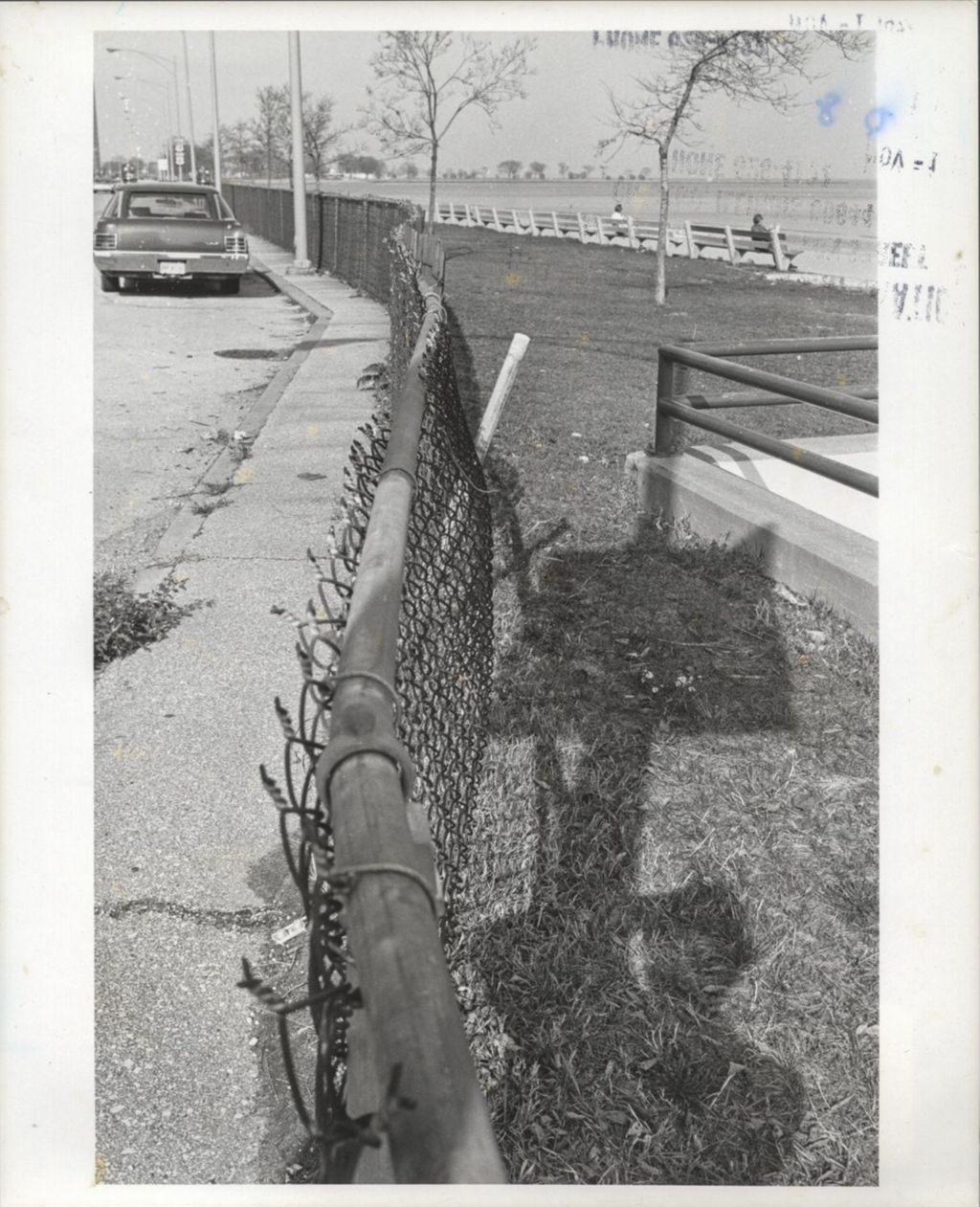 Highway view with chain-link fence
