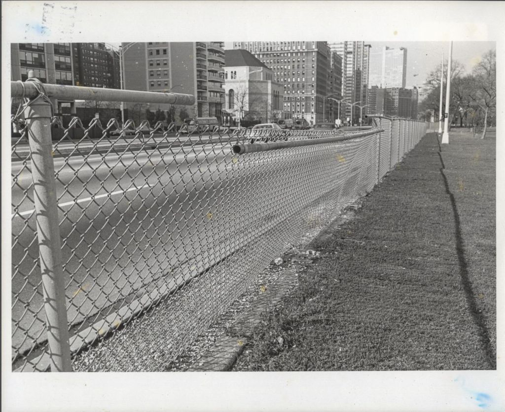 Highway view with chain-link fence