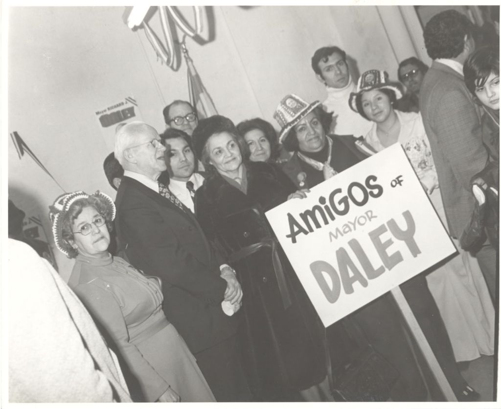 Mexican American Democratic Organization mayoral campaign event, group with "Amigos of Daley" sign