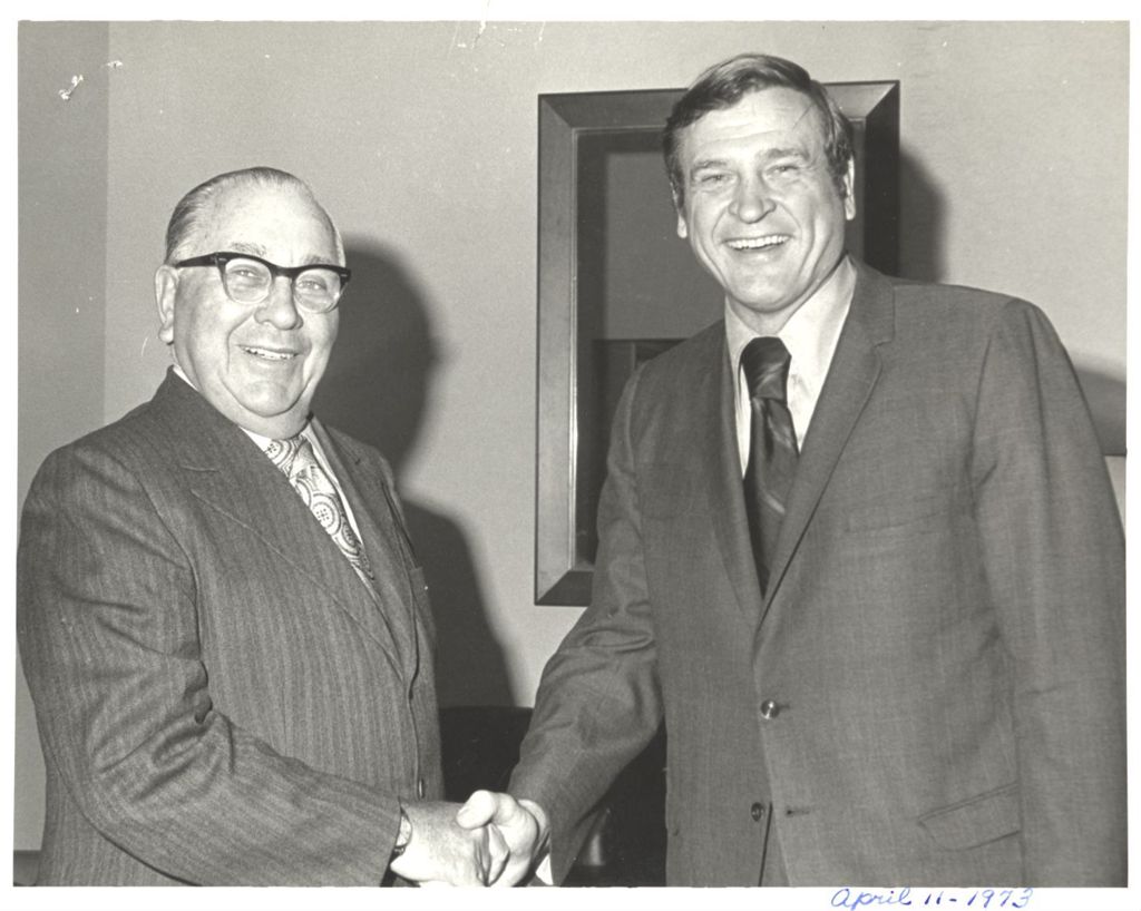 Richard J. Daley shaking hands with Dan Rostenkowski