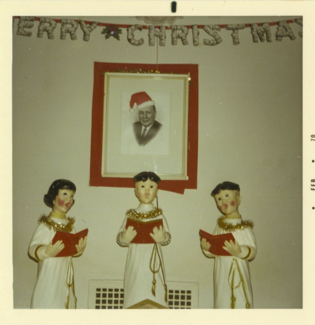 Miniature of Christmas decorations and a picture of Daley wearing a Santa hat