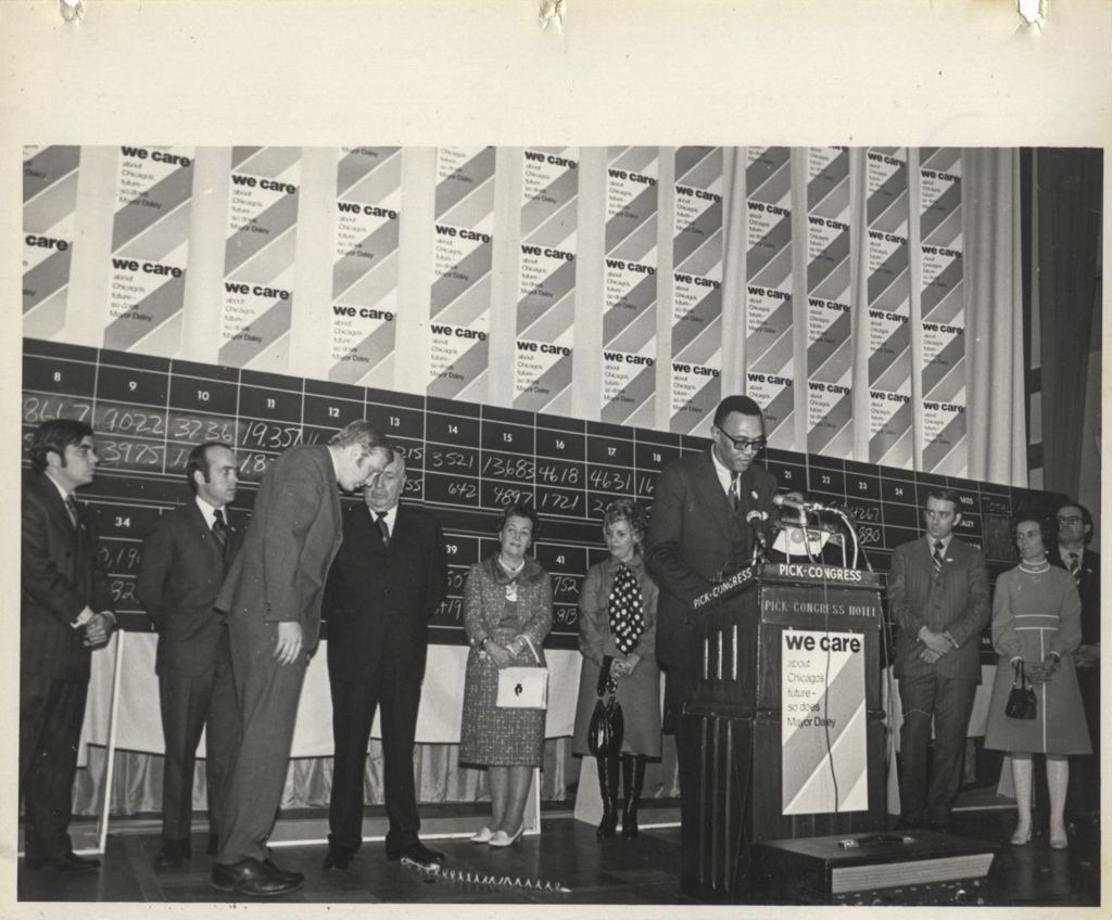 Joseph E. Bertrand speaking at a "We Care" election event