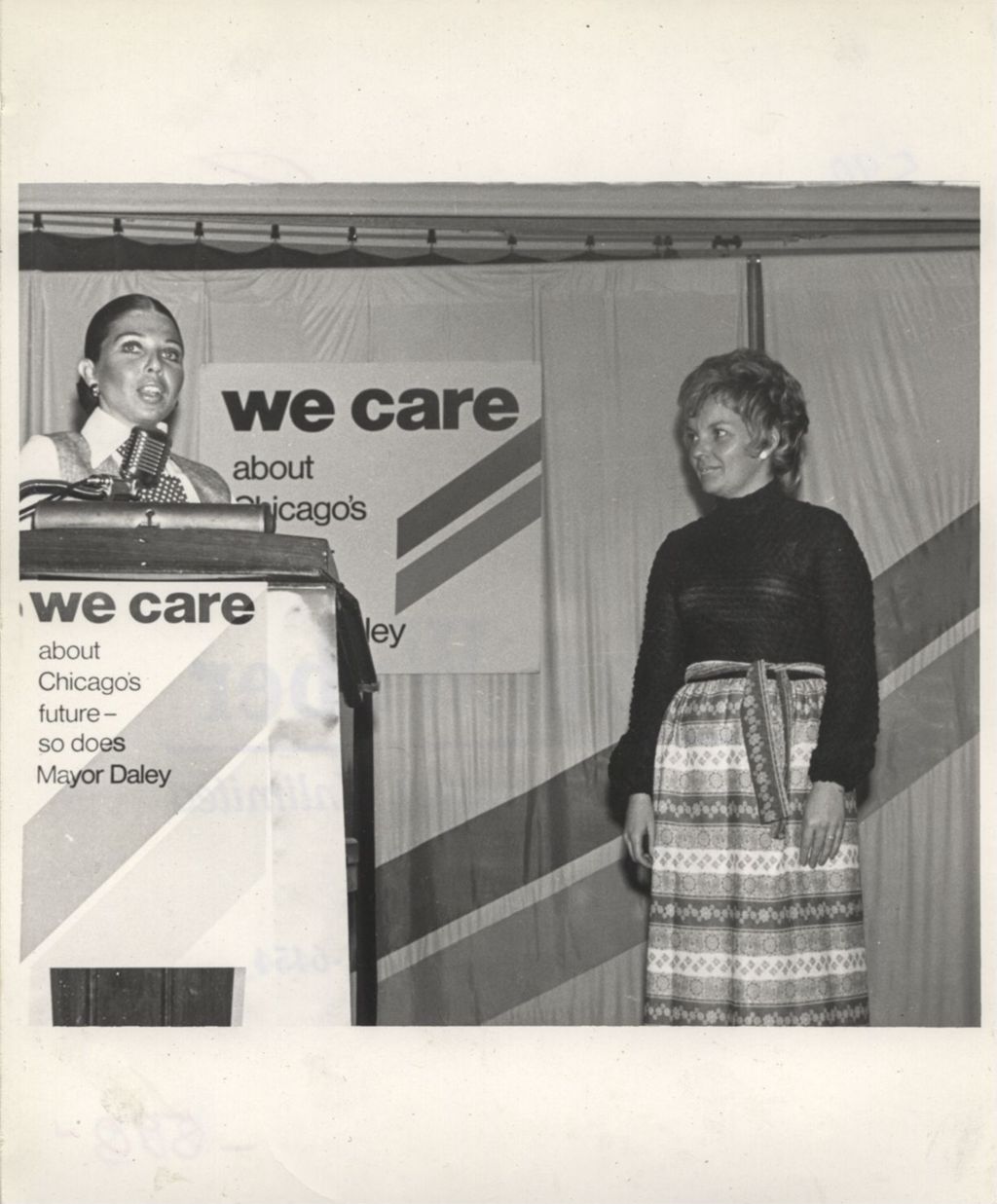 Miniature of Eleanor R. Daley modeling an outfit at a "We Care" event