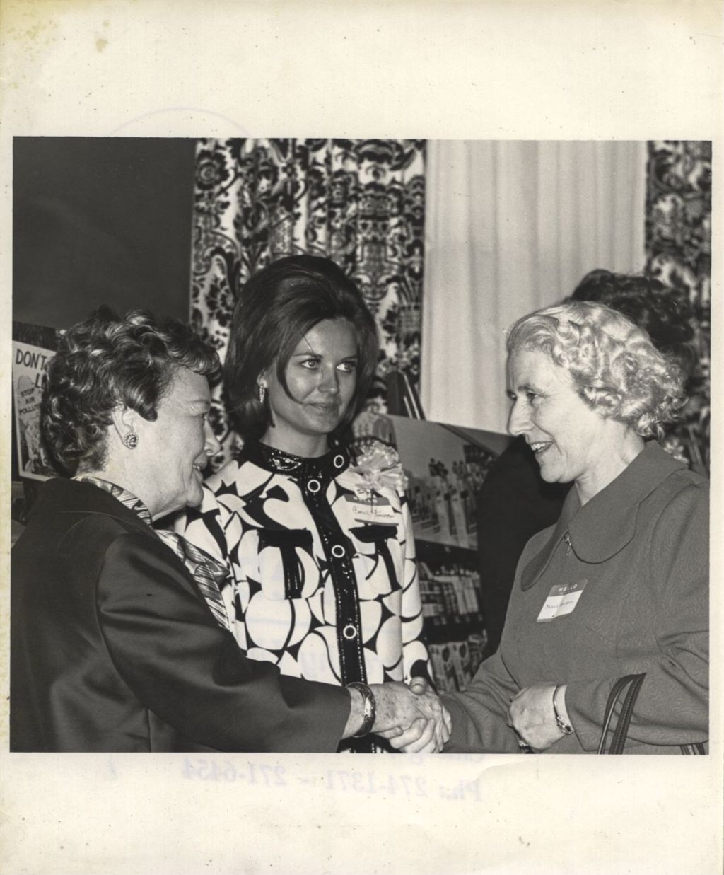 Miniature of Eleanor Daley in a receiving line chatting with a woman at a "We Care" event
