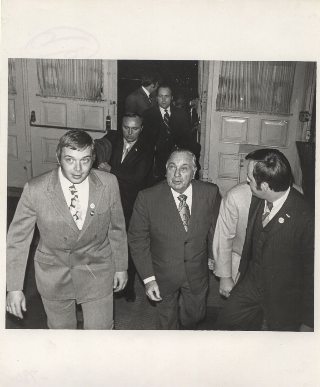 Miniature of Richard J. Daley entering a building from outside