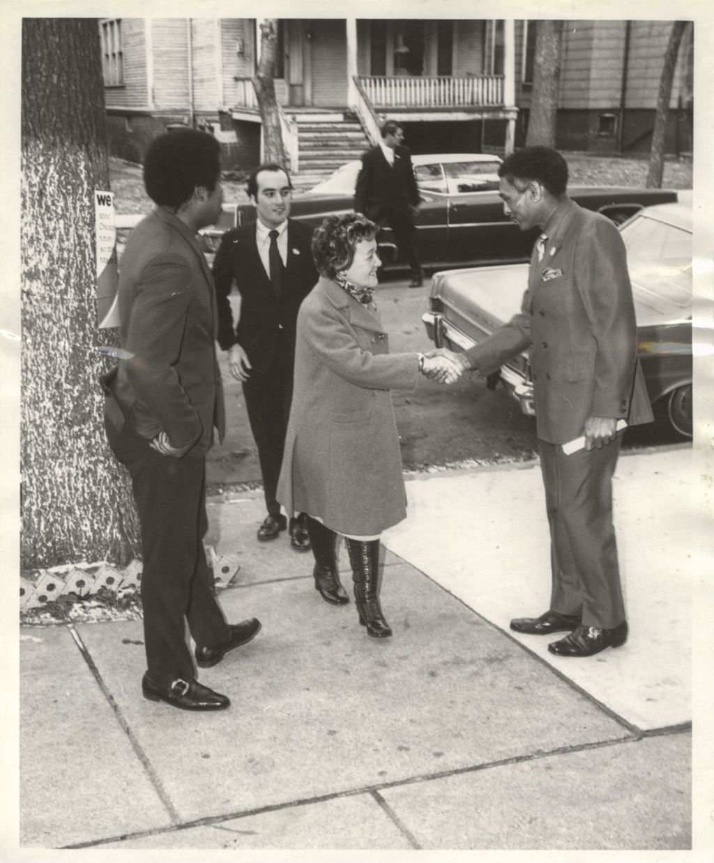 Eleanor Daley shaking hands with a man during the "We Care" campaign