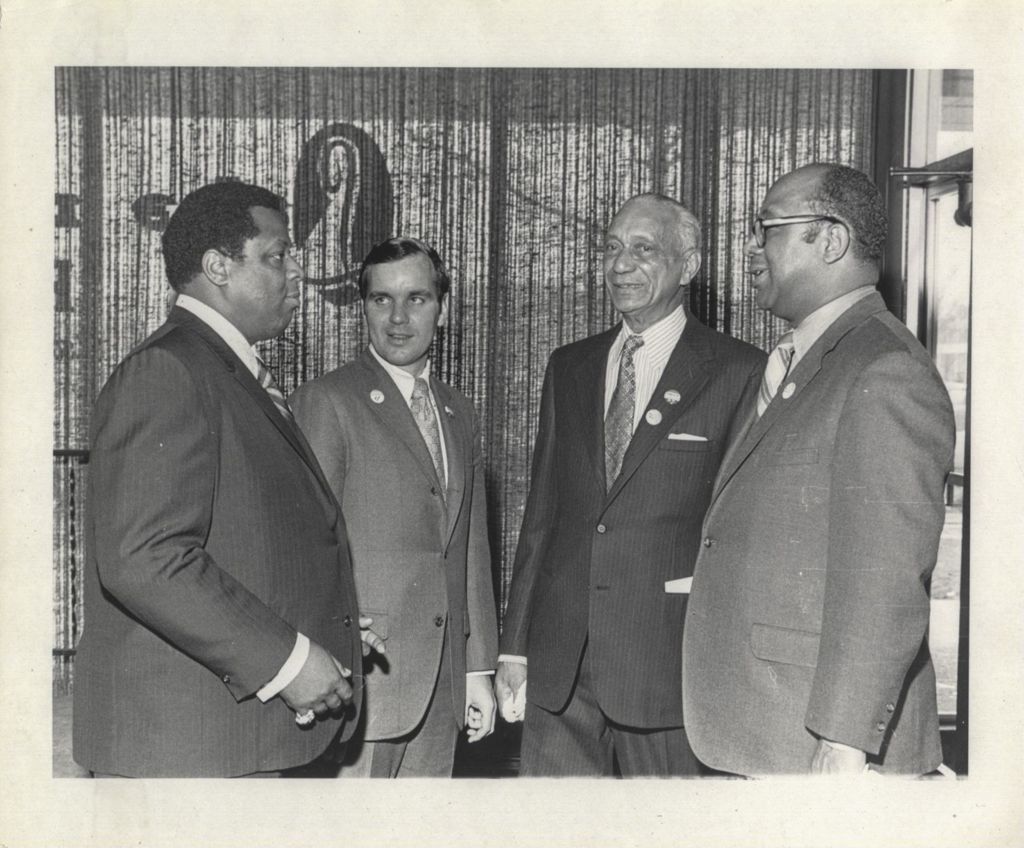 Miniature of Three men with Richard M. Daley at a "We Care" event