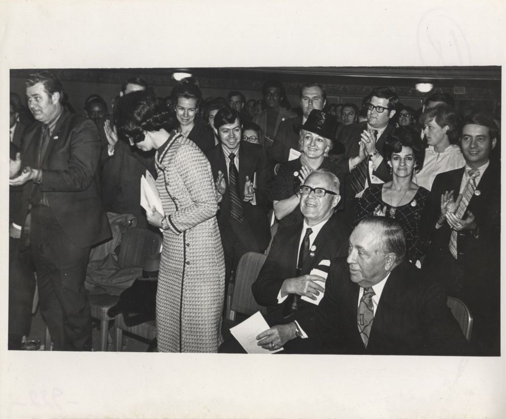 Miniature of Richard J. Daley seated in an audience at a "We Care" event