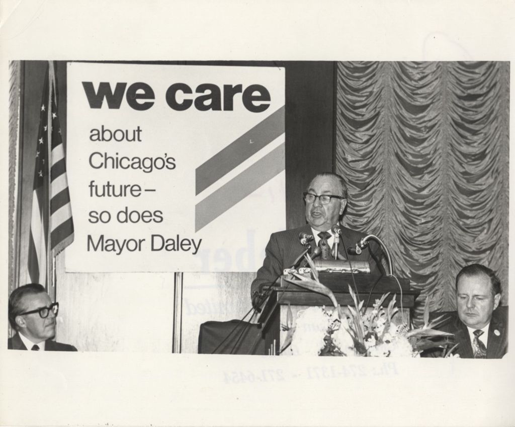 Miniature of Richard J. Daley giving a speech at a "We Care" event