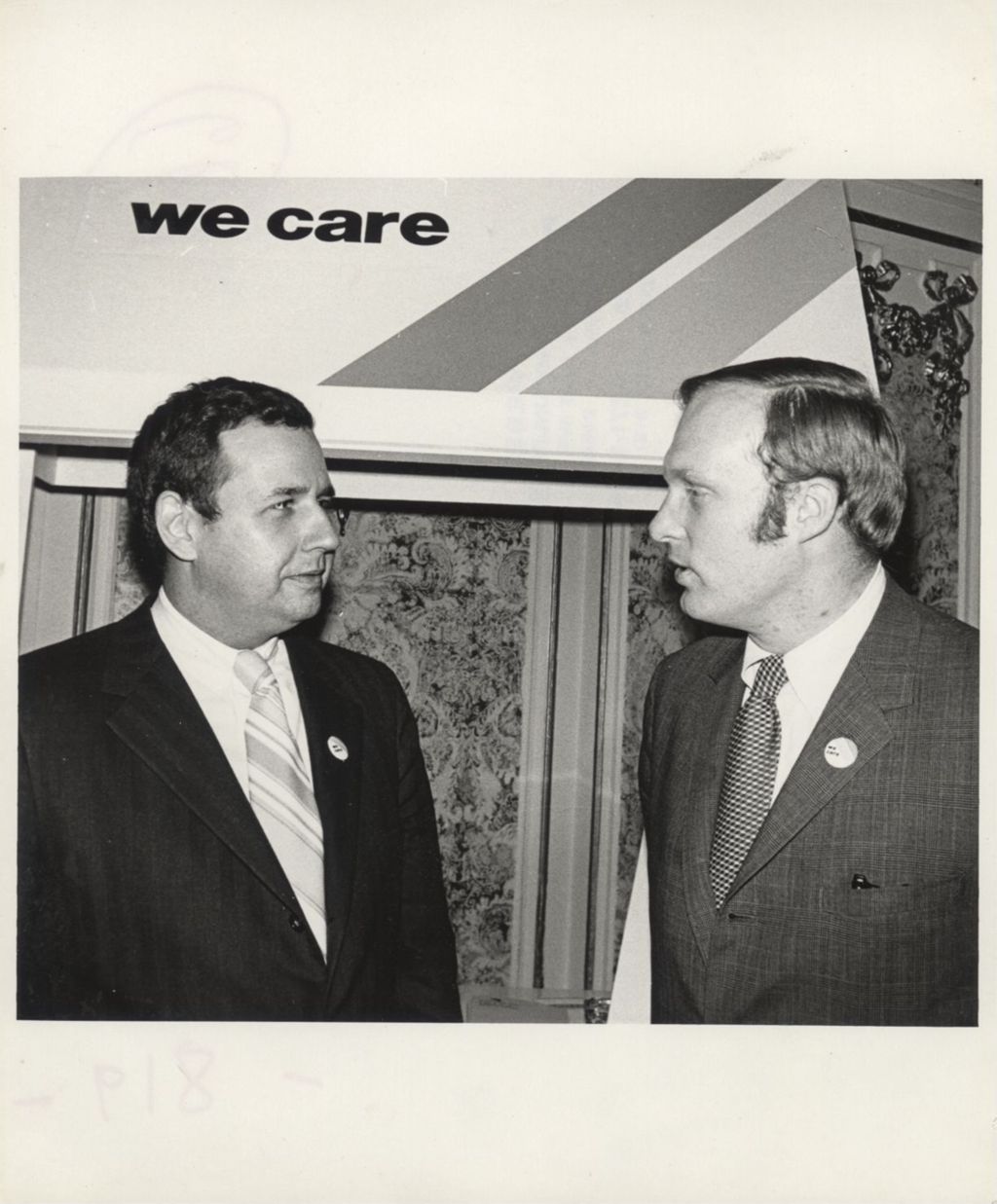 Two men at a "We Care" campaign event