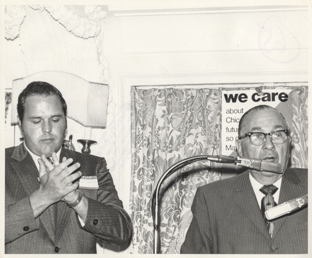 Miniature of Richard J. Daley being applauded at a "We Care" event