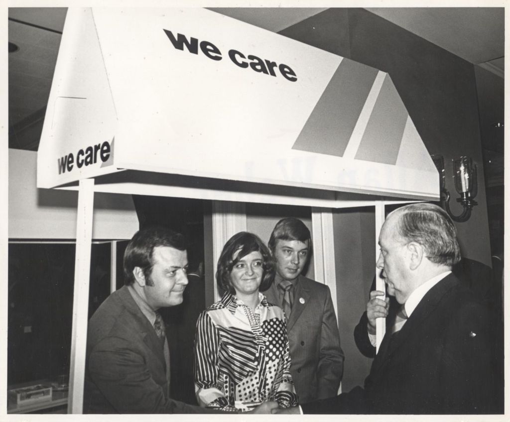 Miniature of Richard J. Daley at a "We Care" kiosk