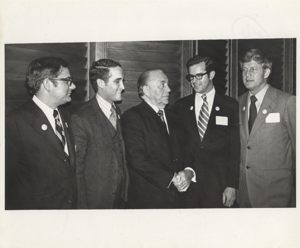 Richard J. Daley with four men at a "We Care" event