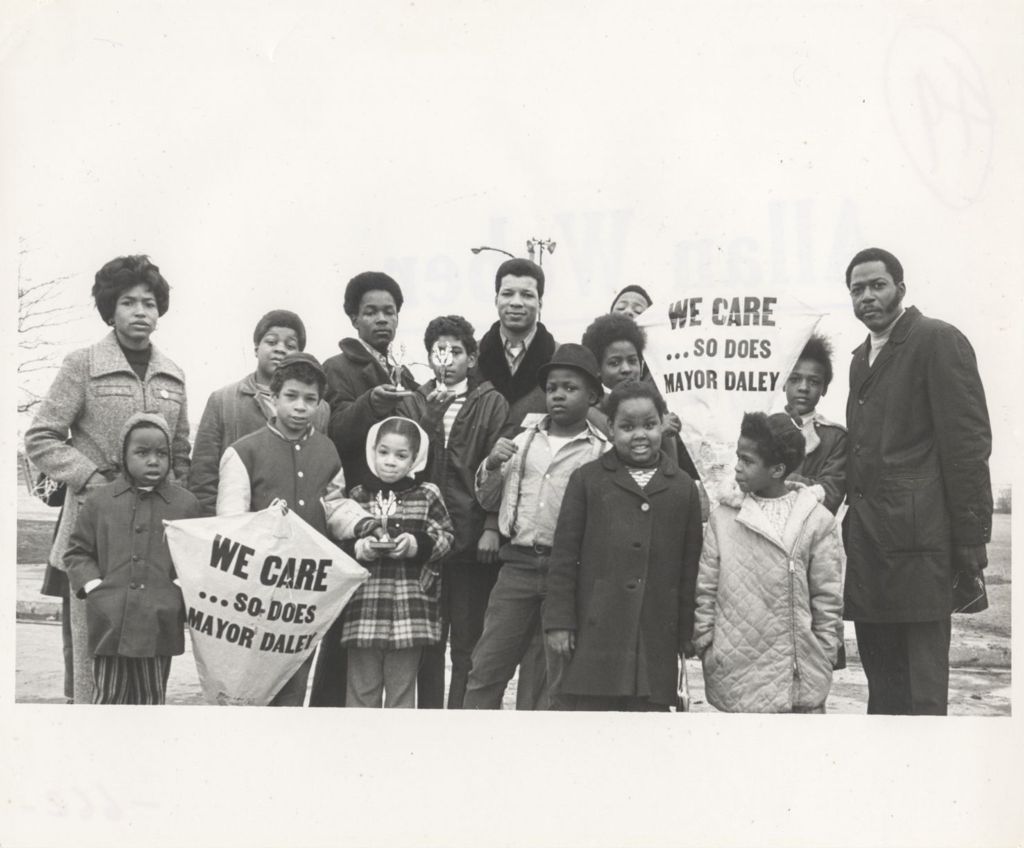 Group of African Americans with Daley "We Care" support kites