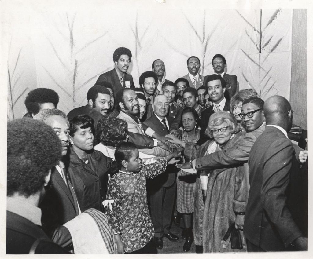 Miniature of Richard J. Daley with group of African Americans at a "We Care" event