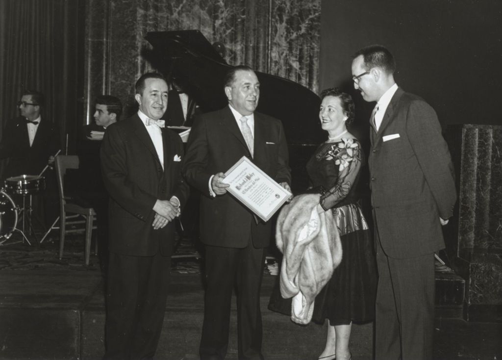 Miniature of Richard J. and Eleanor Daley with "El Hombre del Año" award