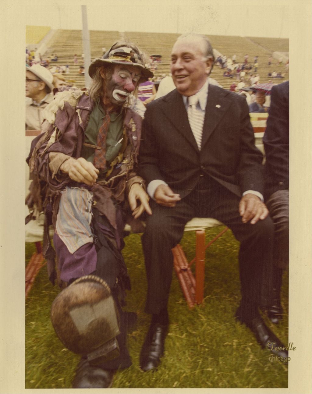 Richard J. Daley sitting with clown Emmett Kelly