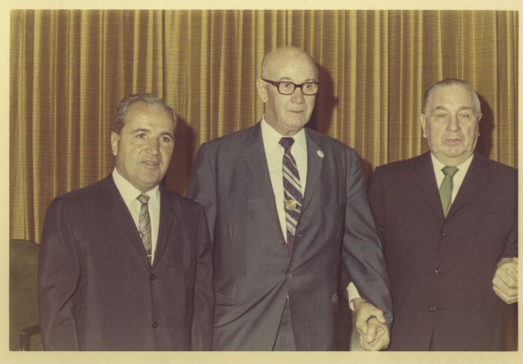 Miniature of Richard J. Daley with two men at a reception