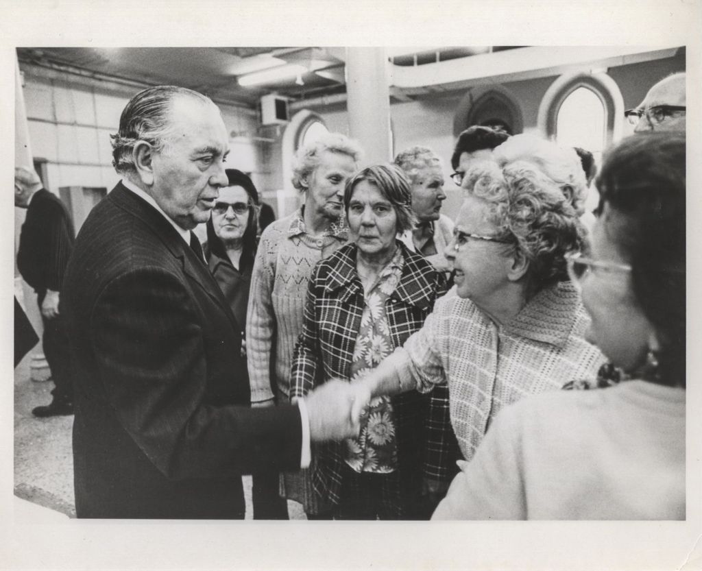 Miniature of Richard J. Daley with women at St. Pius V Church event