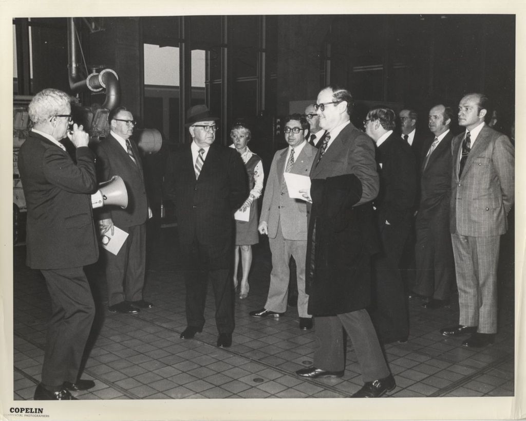 Miniature of Richard J. Daley with a group at a facility