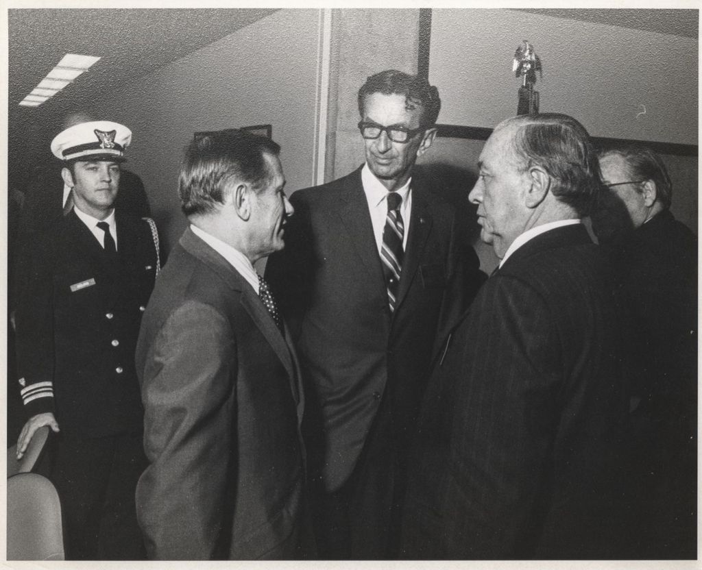 Richard J. Daley in conversation with two men