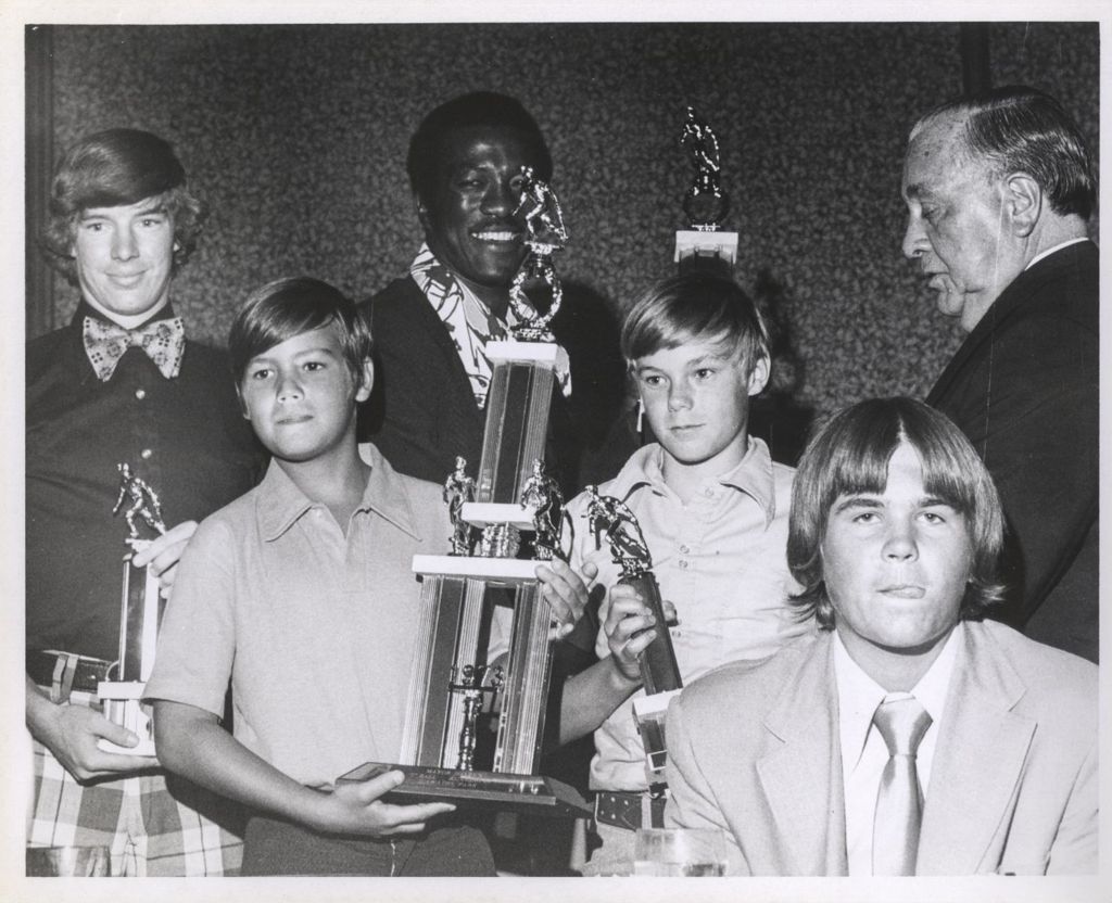 Richard J. Daley with men and boys holding T-ball trophies