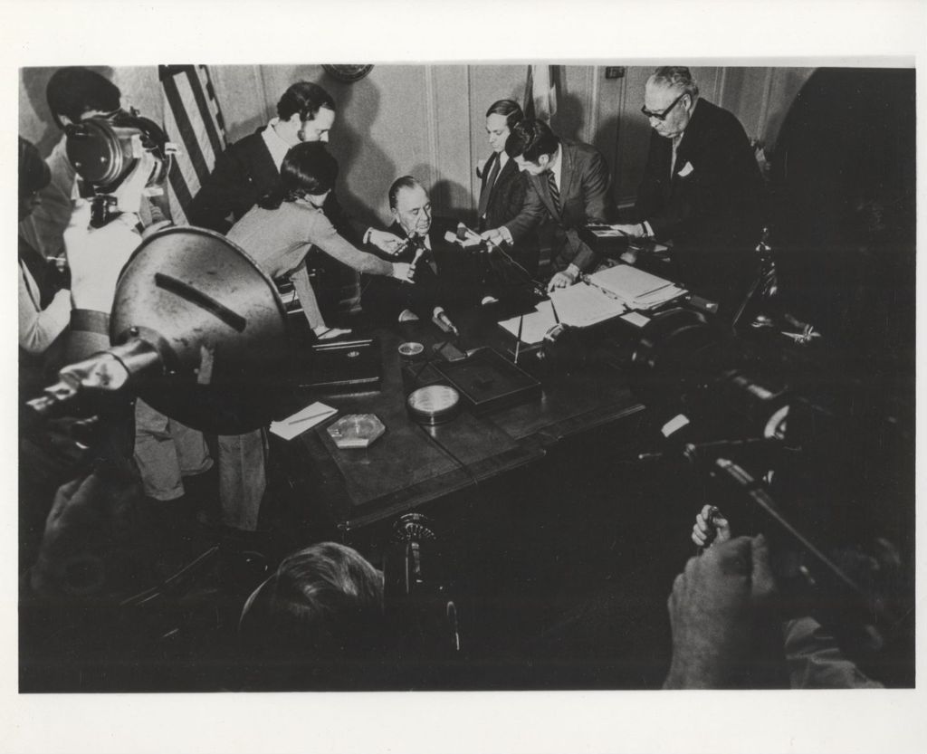 Richard J. Daley speaking to reporters from his desk
