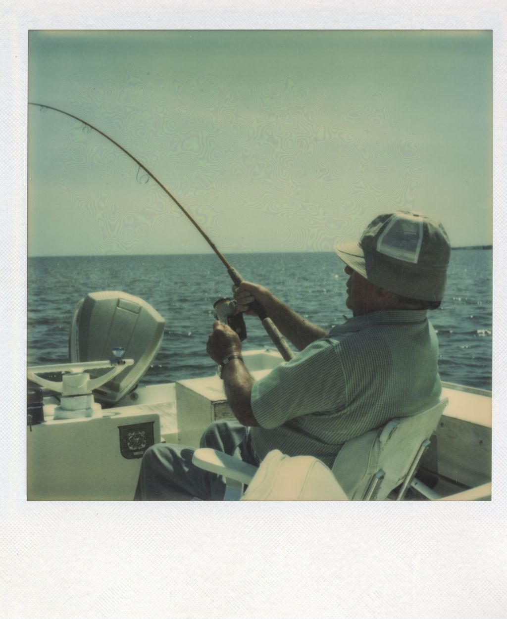 Miniature of Richard J. Daley fishing from a boat