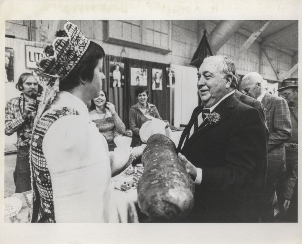 Miniature of Richard J. Daley with loaf of bread at a Holiday Folk Fair