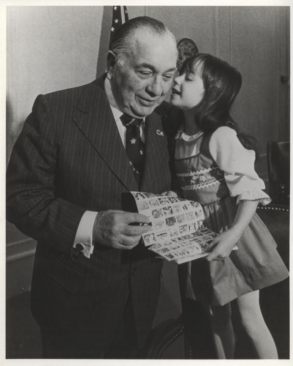 Richard J. Daley and young girl (whispering) with Christmas Seals