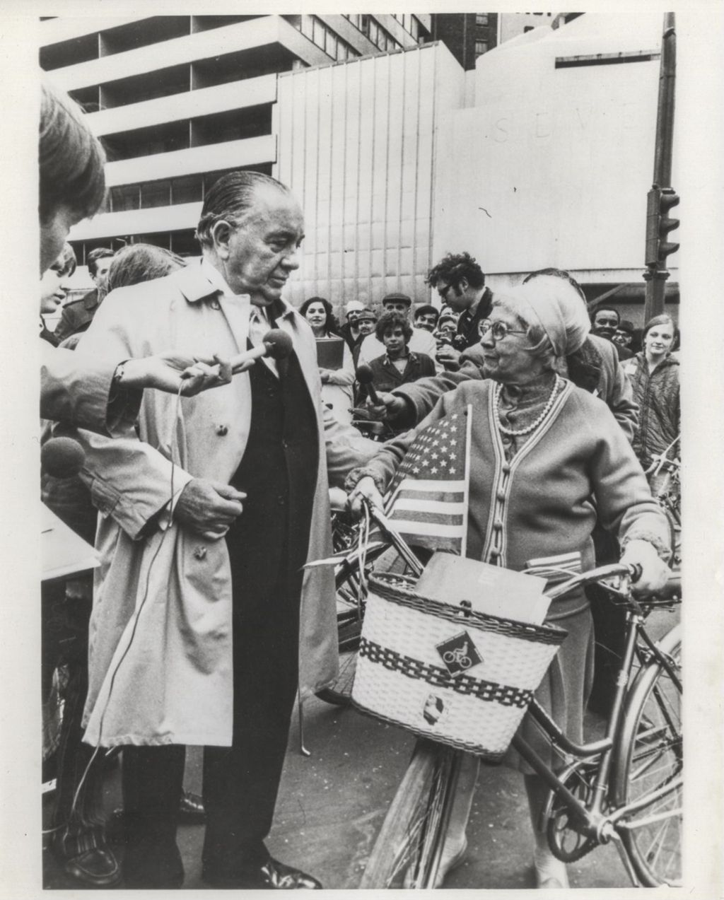 Richard J. Daley standing with a woman with a bicycle