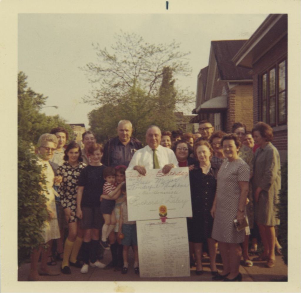 Richard J. Daley holding Happy Birthday sign from his neighbors