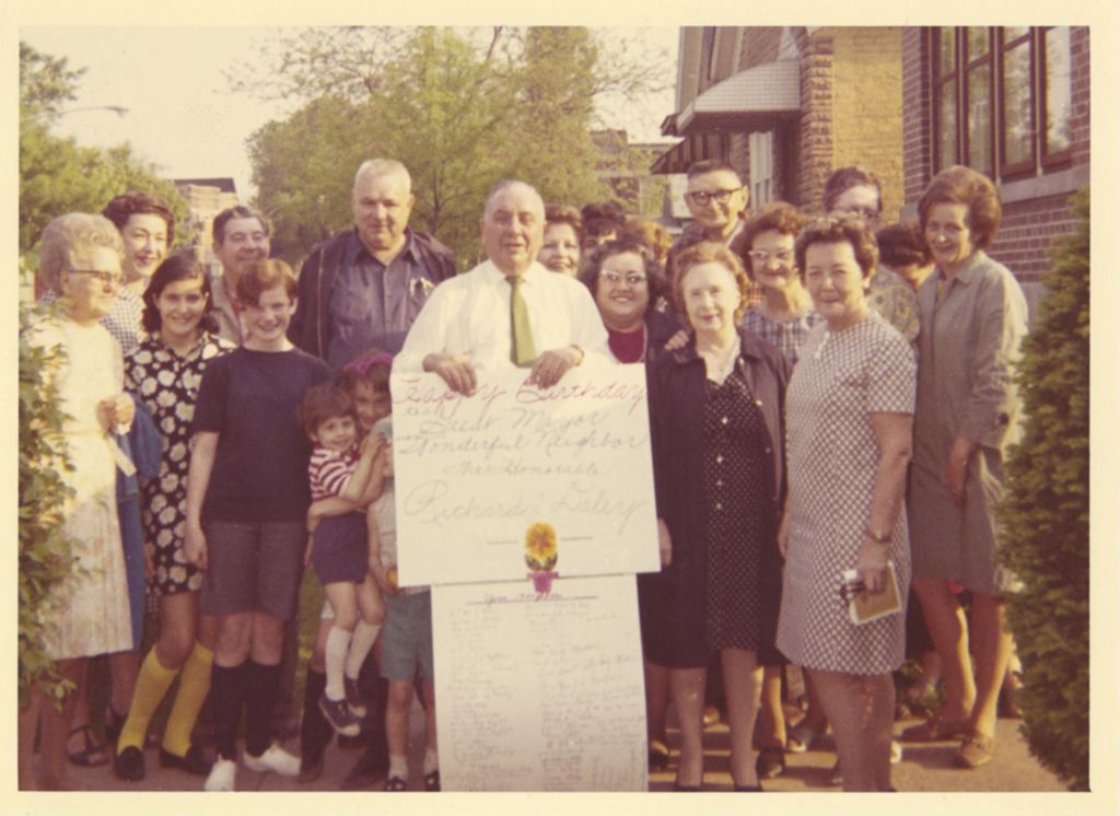 Richard J. Daley holding Happy Birthday sign from his neighbors