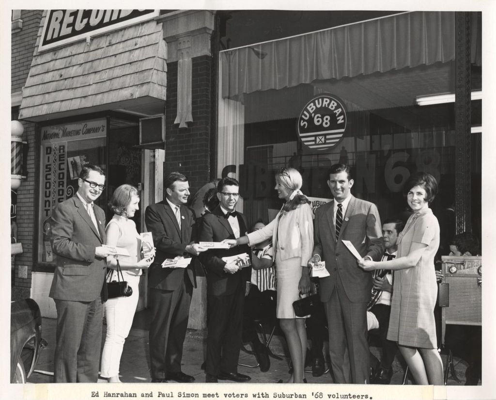 Miniature of Ed Hanrahan, Paul Simon and volunteers outside a Suburban '68 office