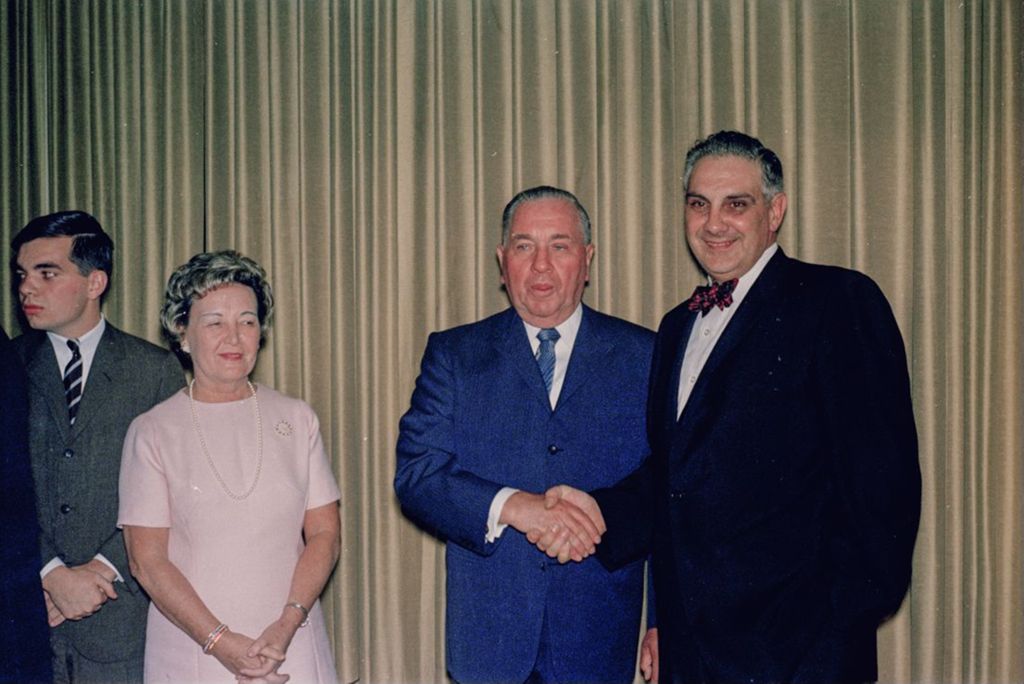 Fourth mayoral inauguration reception, Richard J., Eleanor and John Daley with an attendee