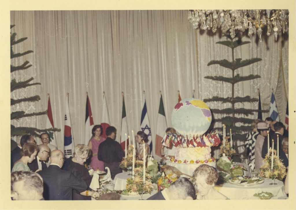 Miniature of Foreign Consul Reception, attendees around buffet tables