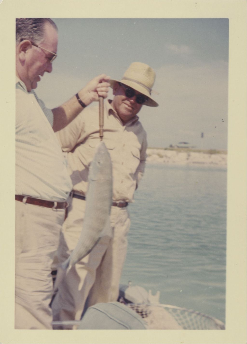 Richard J. Daley displays a fish