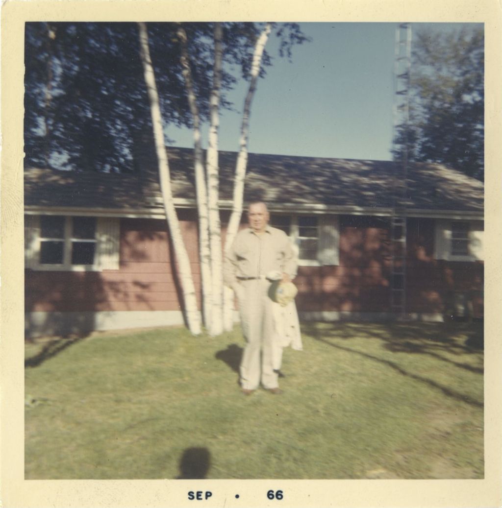Richard J. Daley in front of a house, ready for a fishing trip