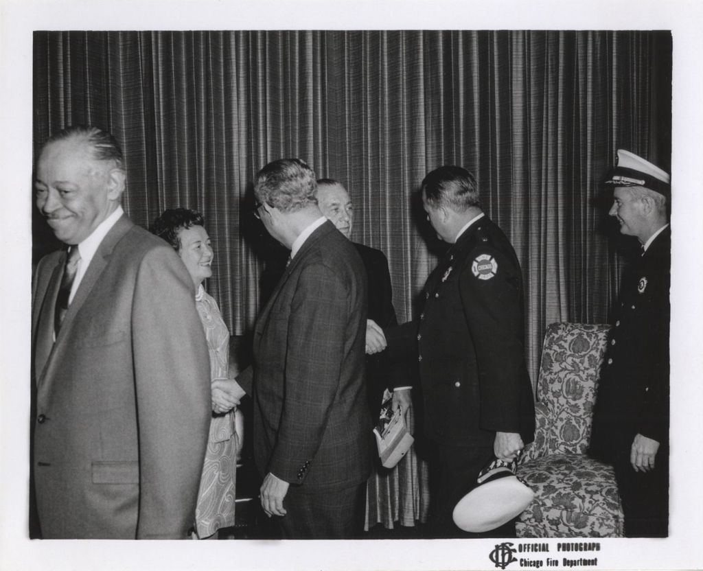 Fire Department Event, Richard J. and Eleanor Daley shaking hands